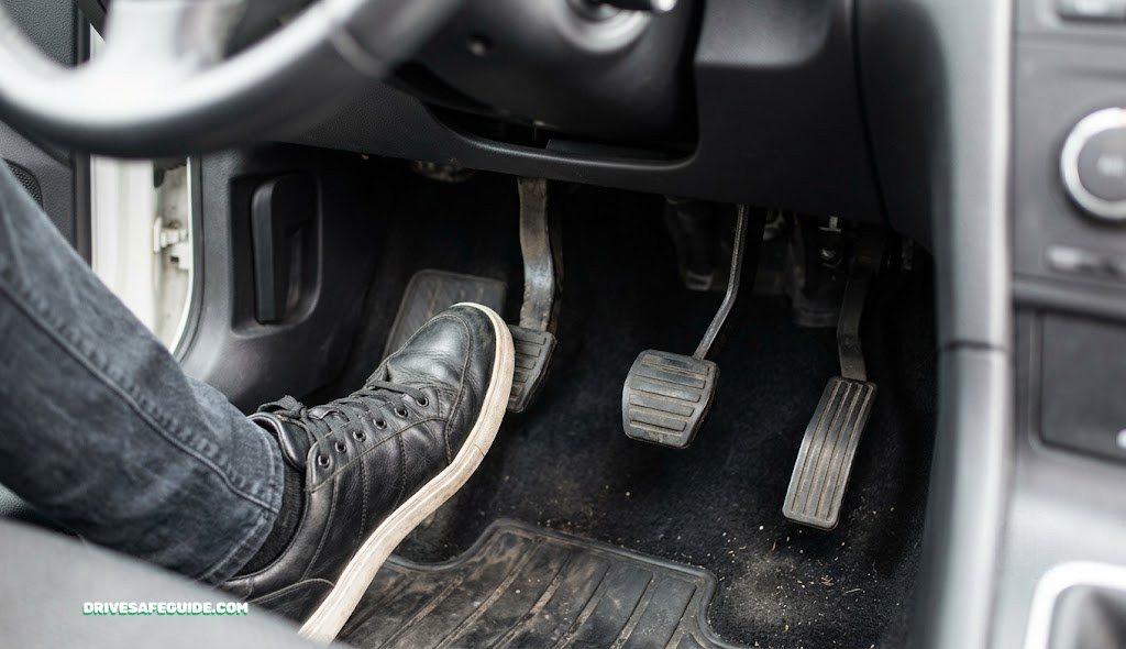 Close-up of a clutch and gas pedal in a manual transmission car