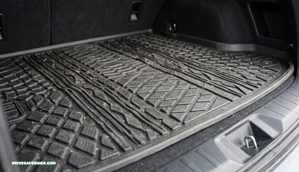 Close-up of textured rubber cargo liner material in a car trunk